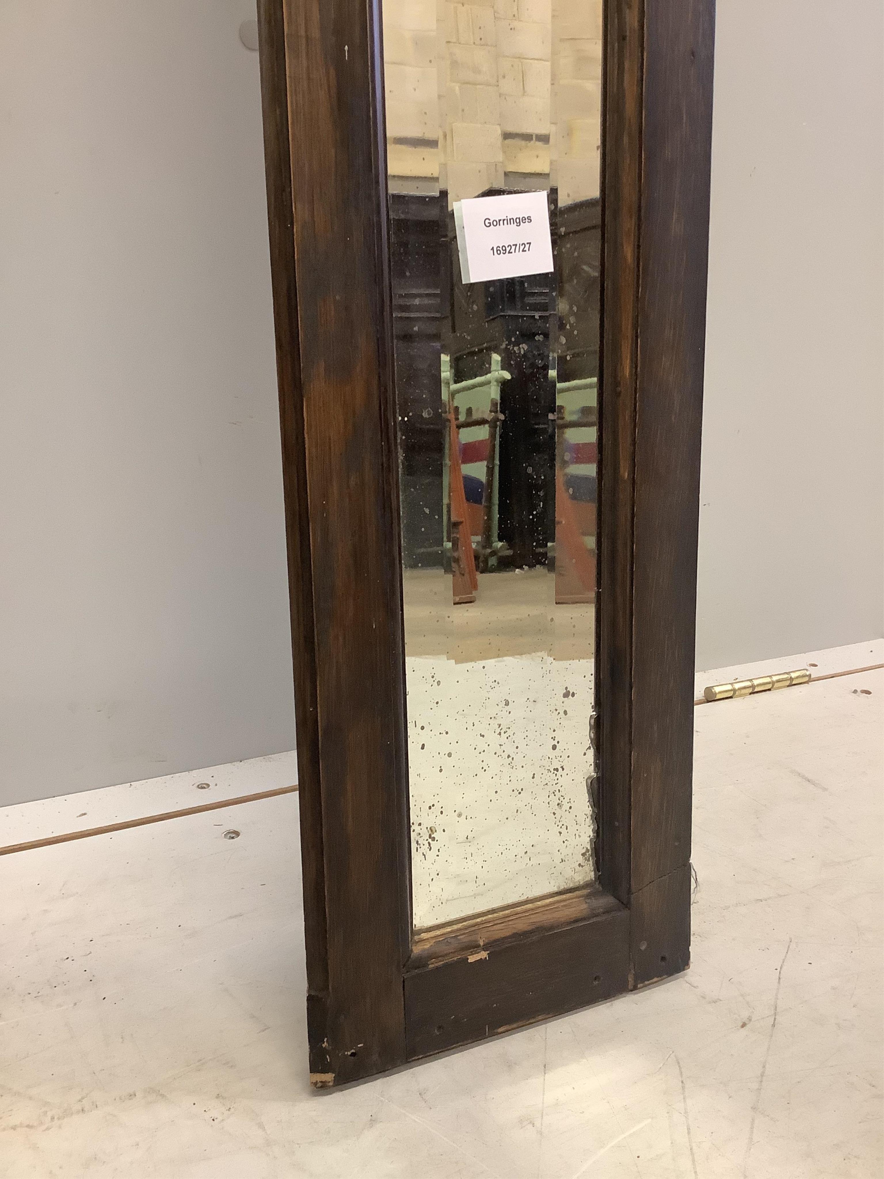 An unusual Victorian narrow oak mirror, width 20cm, length 223cm. Condition - fair to good, plate cracked to one corner